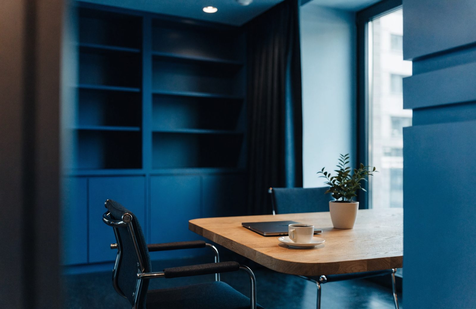 A quiet meeting table set for a two-person conversation